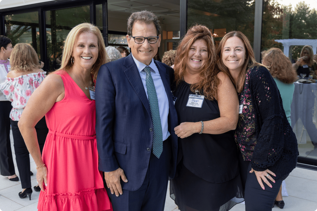 A small group of staff members pose for a photo during Employee Appreciation Day at NYU Langone.